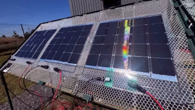 A flexible solar film being applied to a commercial rooftop surface.