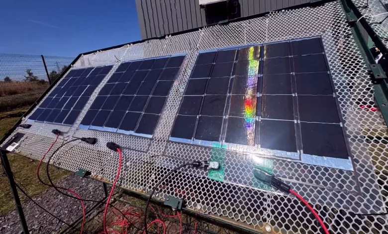 A flexible solar film being applied to a commercial rooftop surface.