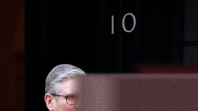 Downing Street spokesperson at a press briefing podium.