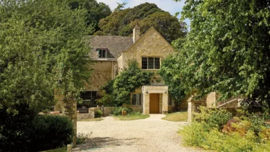 A 1920s Cotswolds-inspired Arts & Crafts house set within extensive landscaped gardens.
