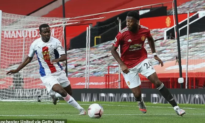 A footballer training on a professional academy pitch.