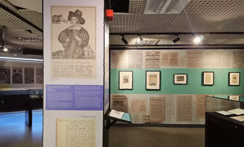 Display case showing historical court documents from the London Archives.