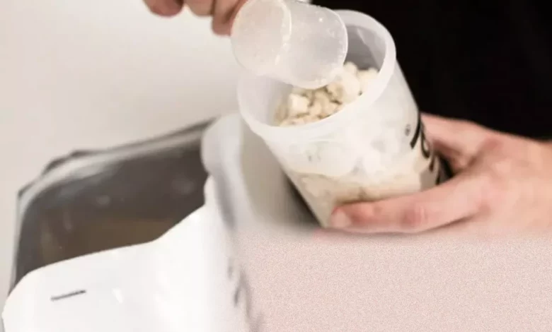 A selection of Huel nutrition shake powders and ready-to-drink bottles on a table.