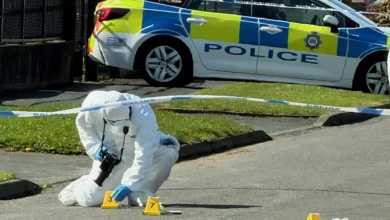 Police cordon tape on a residential street in the Austhorpe area of Leeds.
