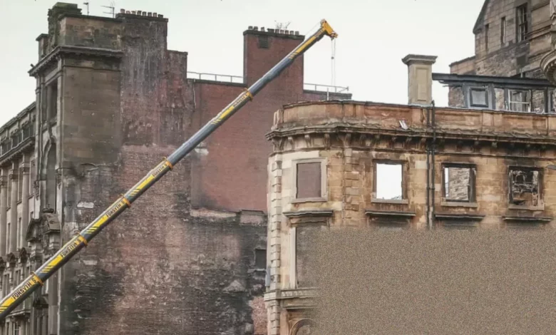 Demolition crews clearing fire damage at Glasgow Central Station's partially reopened main concourse.