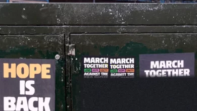 Large crowd gathering for a multicultural march in central London.