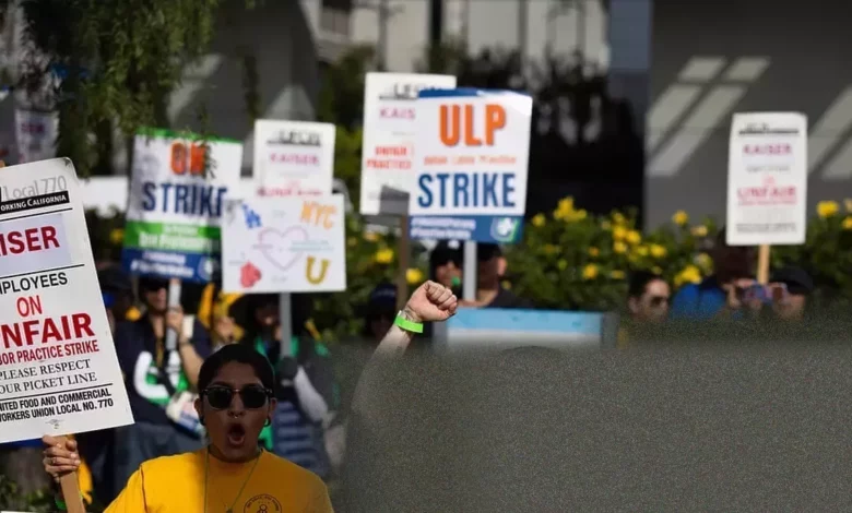 Kaiser Permanente mental health workers on strike outside a clinic.