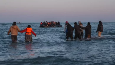 A heavily crowded inflatable dinghy crosses the English Channel.