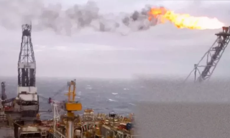 A North Sea oil rig against a stormy sky, representing energy market volatility.