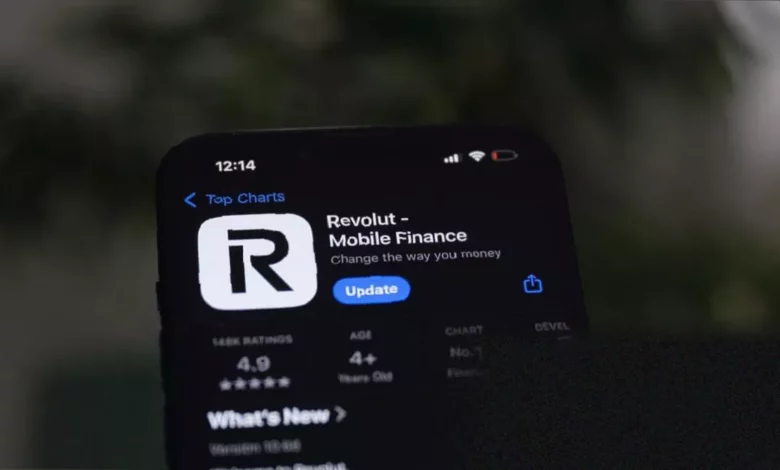 A smartphone displaying a fintech app with cryptocurrency and investment icons.