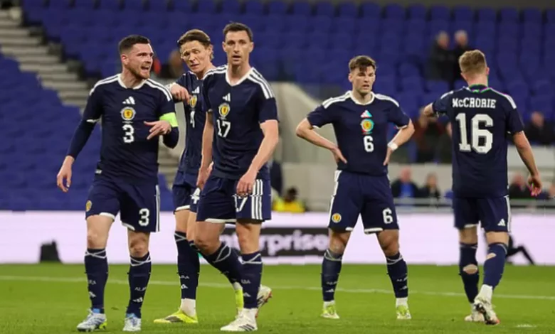 Scotland national football team manager on the touchline during a match.