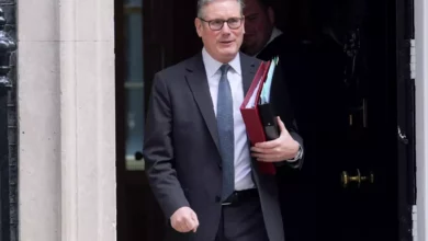 Sir Keir Starmer speaking at a podium with Labour party branding.