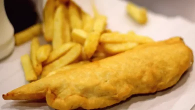 A traditional British fish and chip shop with a quiet counter.