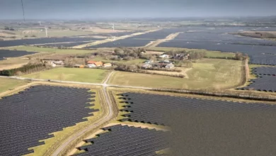 Aerial view of a large solar panel array on Danish farmland.