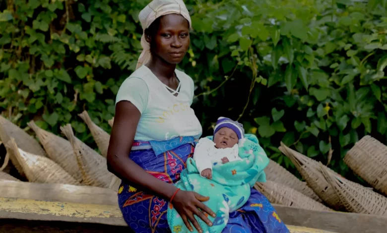 A health center in Zambia where a mother prepares for childbirth without clean water.