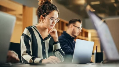 Office workers using digital communication tools and AI software
