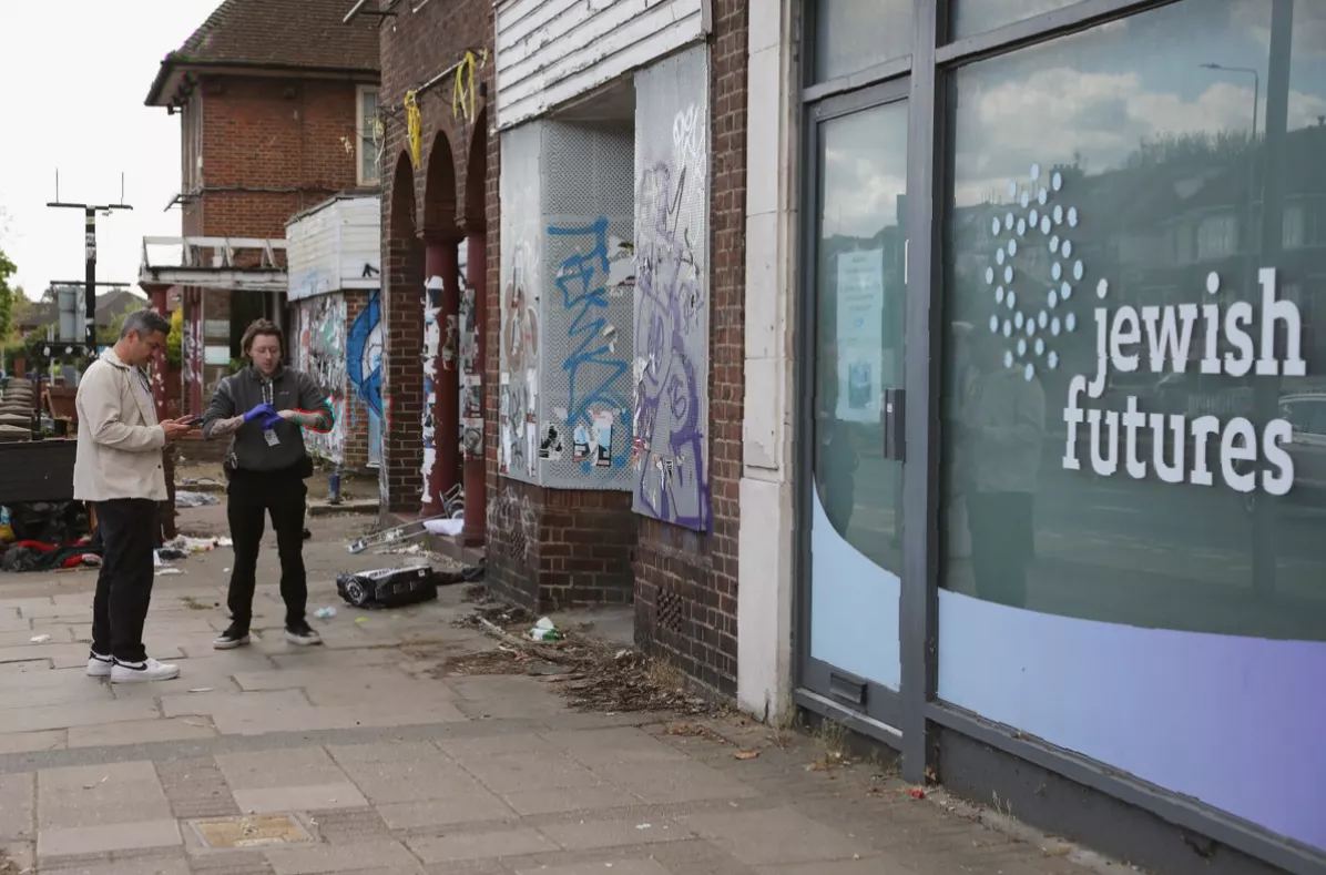 Shopfront in Hendon with minor damage from a failed fire attack.