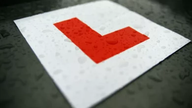 A driving school car parked on a UK street for a learner lesson.