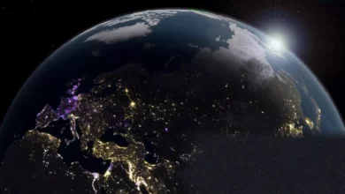 Satellite view of Earth's night-time lights showing patterns of urban brightness.