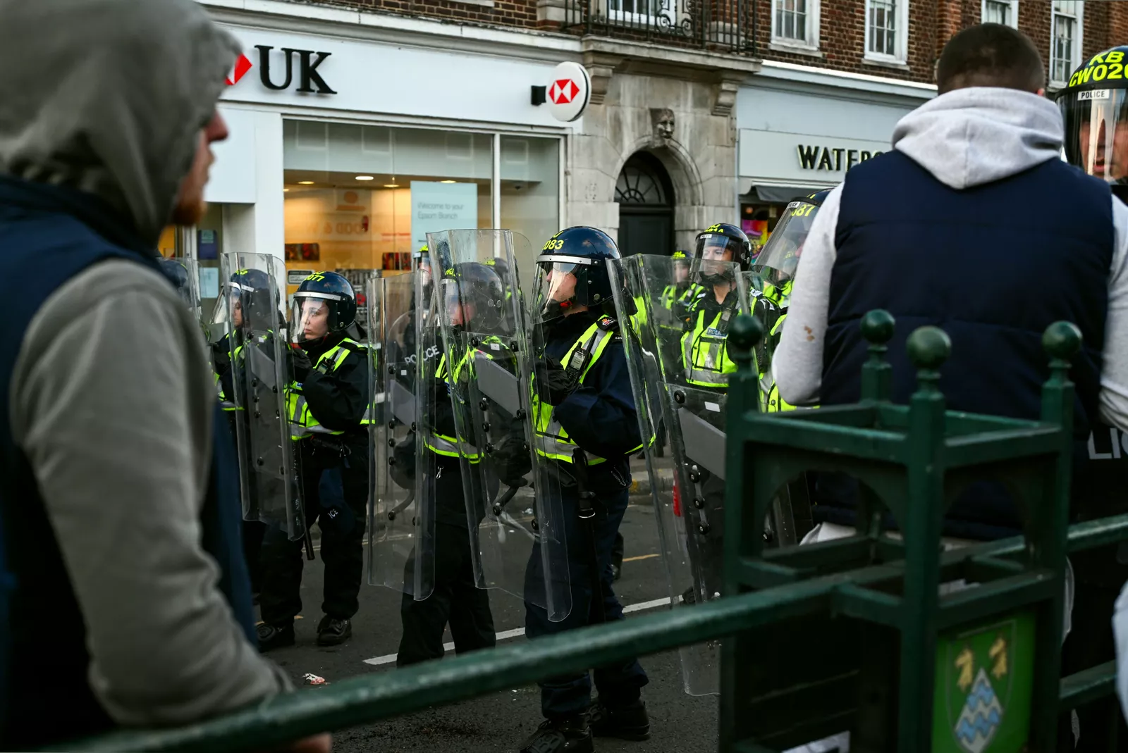 Protesters gathered on a blocked road outside Epsom Methodist Church.