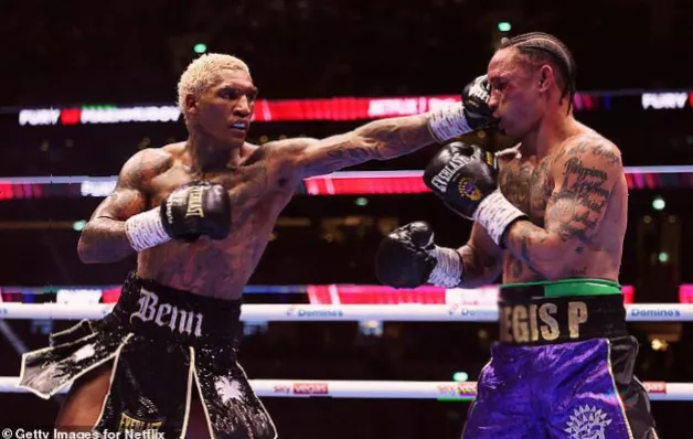 A fighter with a cut on his face during a professional boxing match.