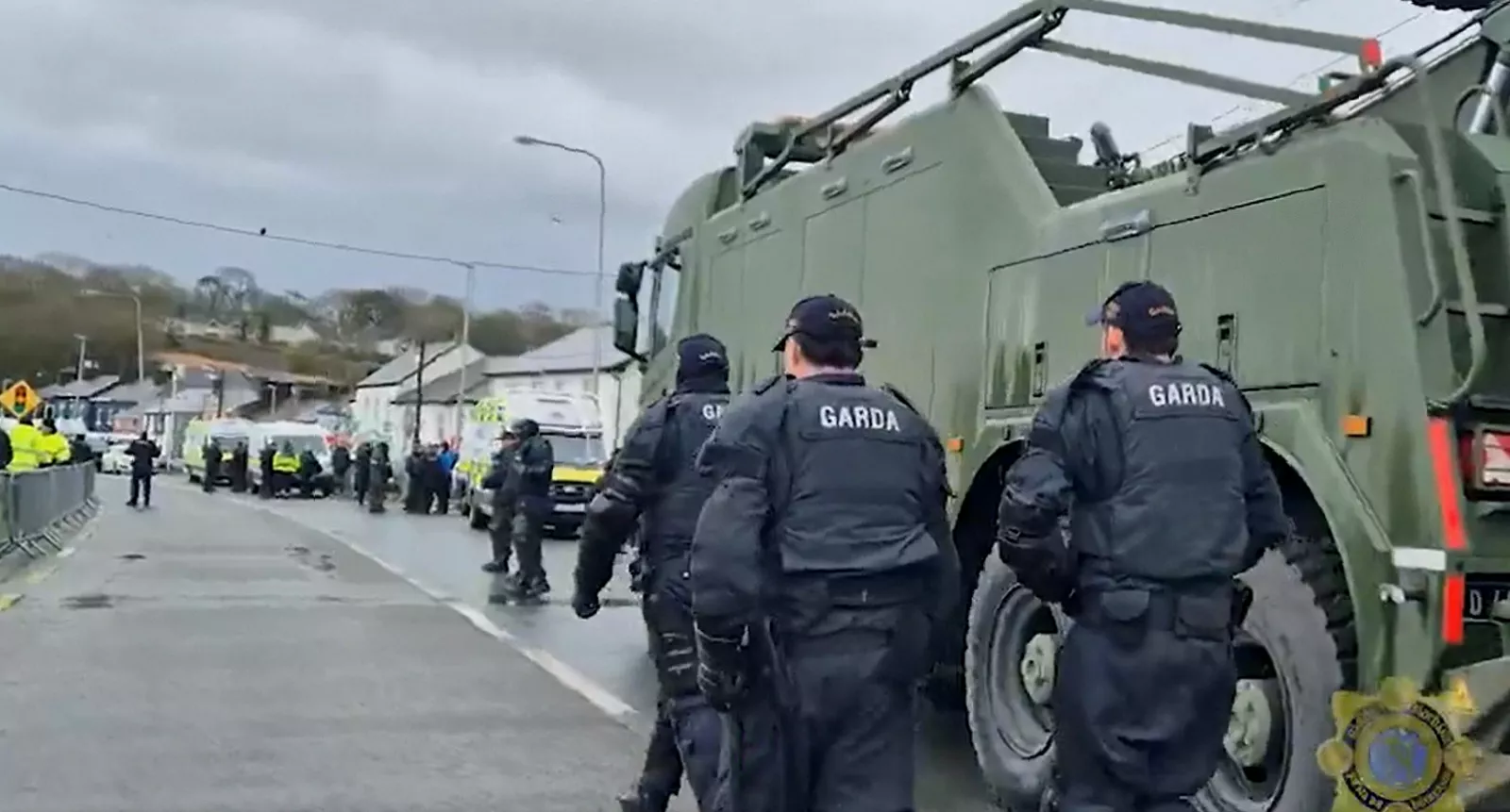 Police and military vehicles deployed to clear a blockade at a fuel depot.