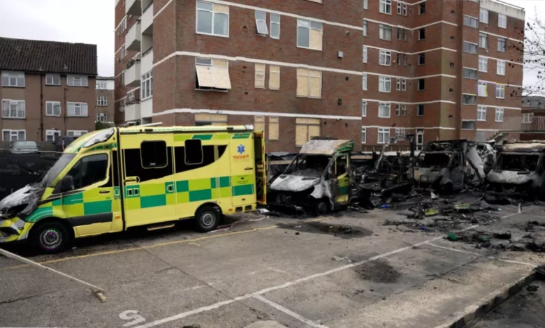 Burnt-out wreckage of emergency ambulances in a synagogue car park.