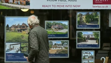 A residential street with a mix of rental properties and letting agent signs.