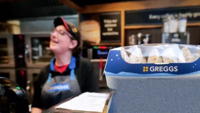 Empty self-service display cabinets in a Greggs store being replaced by staff-operated counters