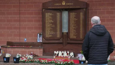 A sombre football stadium on an anniversary of a major disaster.