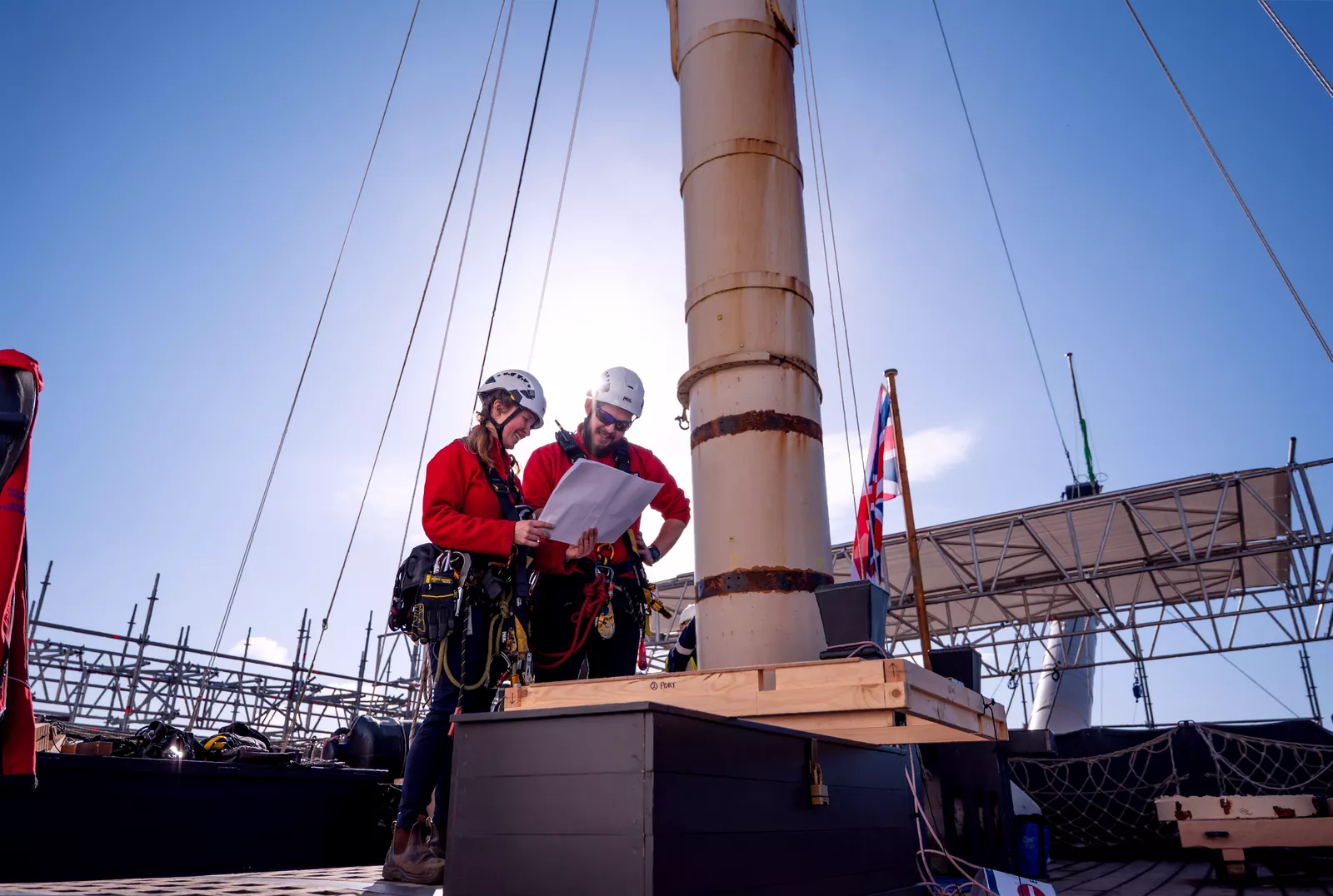 The 18th-century warship HMS Victory in dry dock with scaffolding erected around its hull