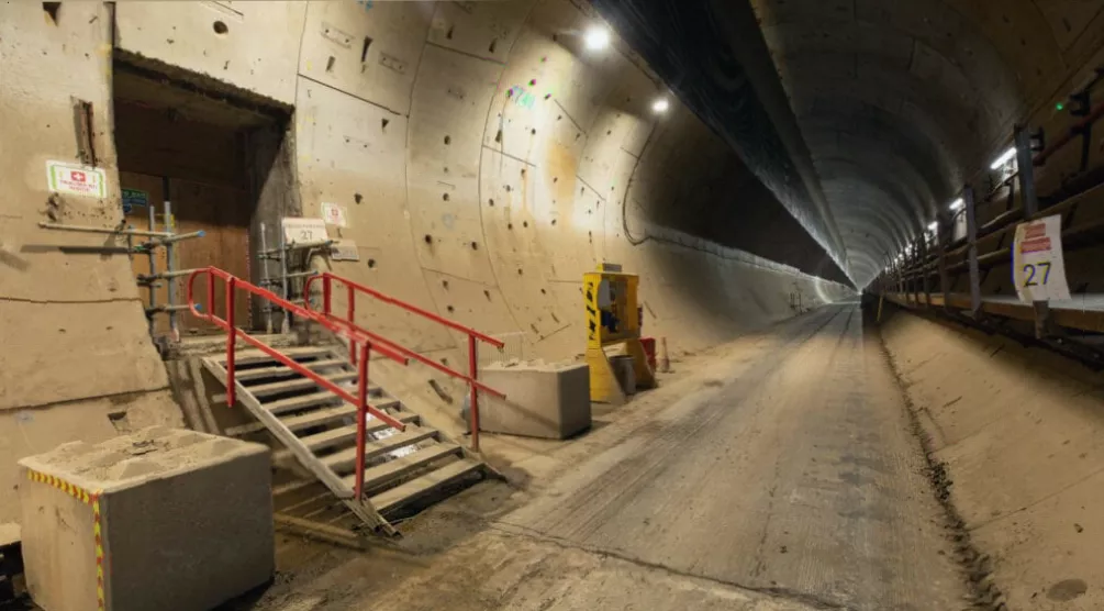 Sprayed concrete being applied to freshly excavated tunnel wall to stabilise the ground