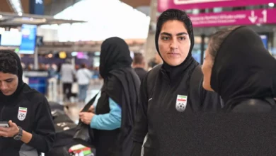 Iranian women's national football team players on the pitch during a match.