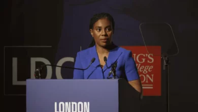 A political leader addresses a defence and security conference in London.