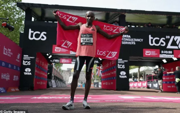 Wheelchair racers compete along the Embankment finish stretch in London
