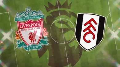 Anfield stadium under floodlights for a Premier League evening match.