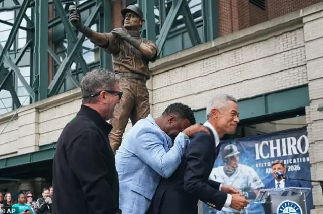 Replica miniature statues being given to fans at a baseball game.