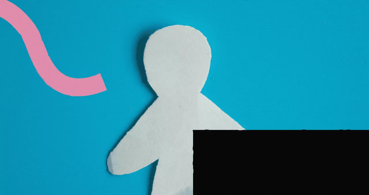A person looking at a small, rationed supply of incontinence pads on a table.
