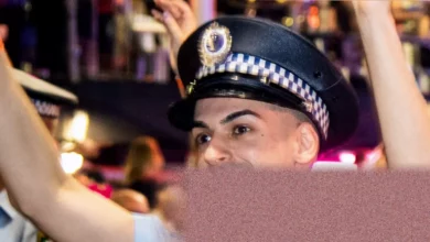 Police officers conducting door-to-door inquiries in Alice Springs outback