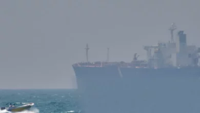 Aerial view of oil tankers navigating the narrow Strait of Hormuz.