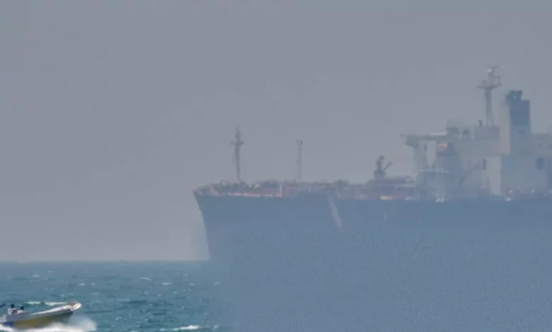 Aerial view of oil tankers navigating the narrow Strait of Hormuz.