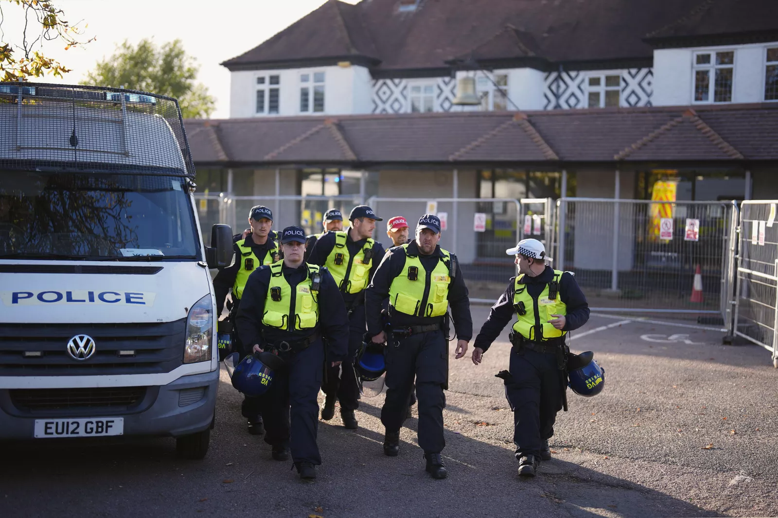 A crowd of demonstrators gathered on a street near the Bell Hotel in Essex.