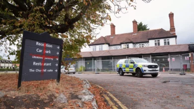 Police officers forming a cordon during a protest outside a hotel in Epping.