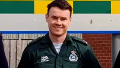 A paramedic's medical equipment and uniform in a clinical setting.