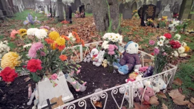 Police cordon tape around a gravesite in a Liverpool cemetery.