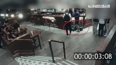CCTV footage of a theft in progress at a busy London pub.