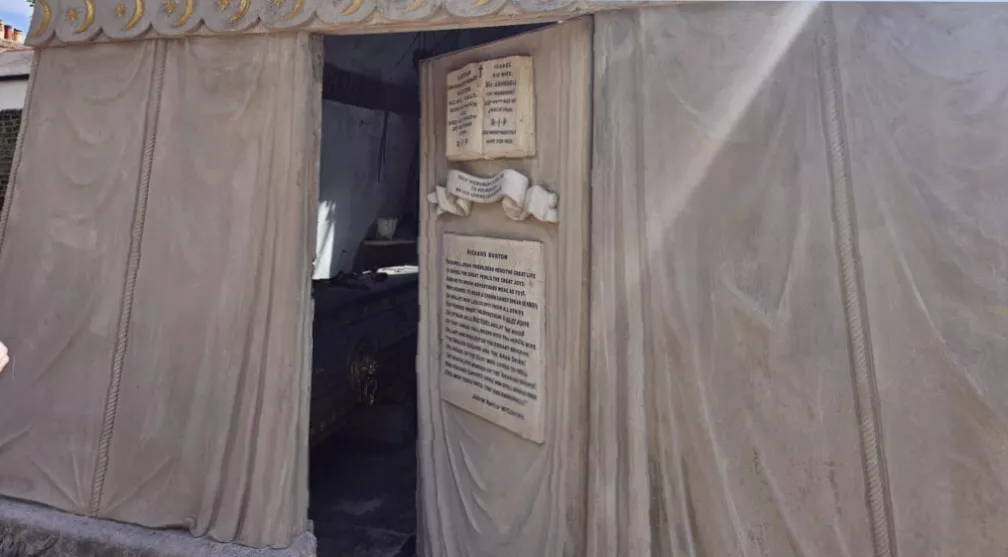 Interior of the mausoleum showing oriental lamps and cherubs on the ceiling