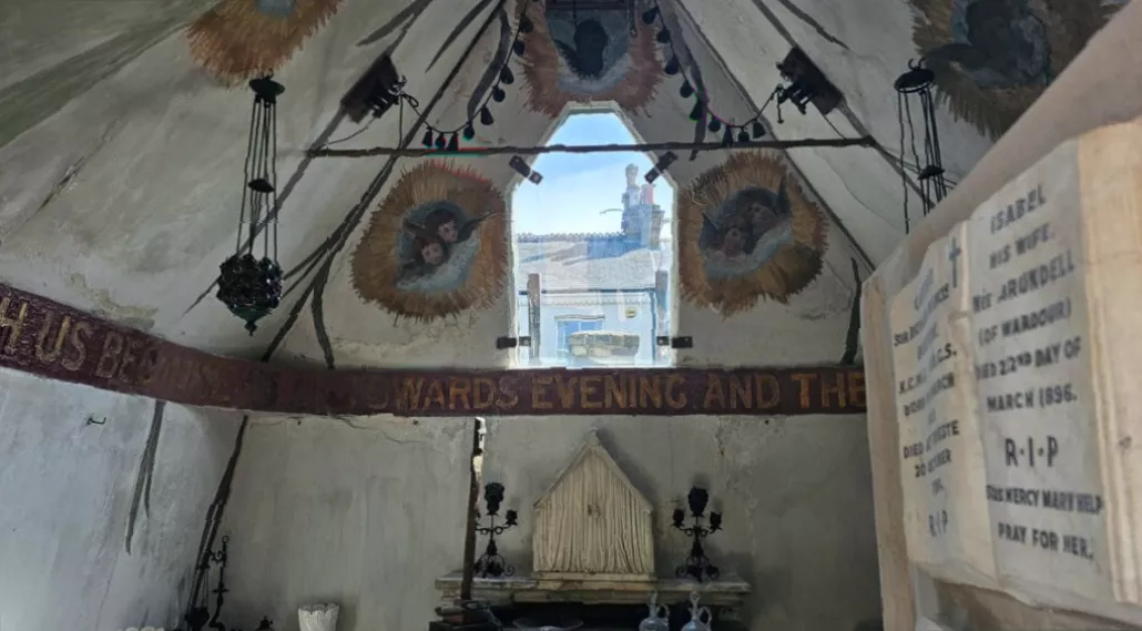 Two stone coffins side by side inside the restored Burton Mausoleum