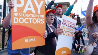NHS hospital corridor with patients waiting for appointments during industrial action.