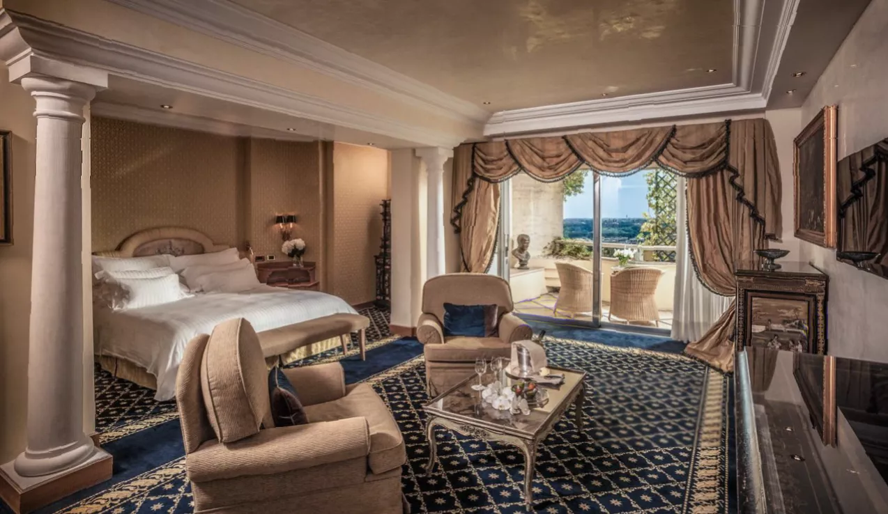A private hotel balcony overlooking Rome's skyline and historic city centre.